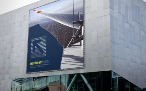 Green Marketing Beispiel Nordwest 2050 Fassadenwerbung an Messehalle